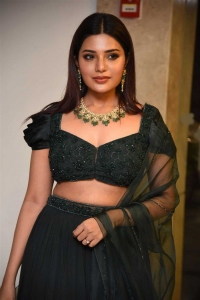Actress Aathmika Green Dress Pictures @ Kodiyil Oruvan Pre Release