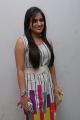 Aksha in Sleeveless White Dress at Gola Seenu Audio Release