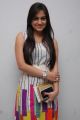 Aksha in Sleeveless White Dress at Gola Seenu Audio Release