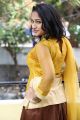 Actress Ambika in Yellow Dress Photos @ Geethapuri Colony Press Meet