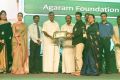 Agaram foundation collecting the award for Best NGO
