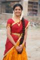 Actress Amrutha Photos in Red Yellow Half Saree
