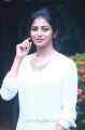 Chandiveeran Actress Anandhi Cute Photos in White Top & Blue Fade Jeans