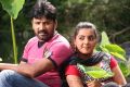 Vignesh, Divya Nagesh in Bhuvanakaadu Movie Stills