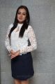 Actress Catherine Tresa Stills in White Top & Business Skirt