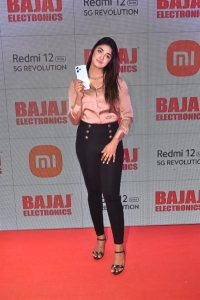 Actress Dimple Hayathi Unveils Redmi 12 5G at Bajaj Electronics Photos