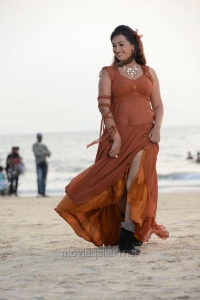 Actress Esther Noronha Hot Pictures in Moderate Orange Color Dress