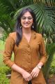 Actress Haripriya in Orange Top & Blue Jeans Photos