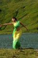 Kajal Hot Green Yellow Saree Stills in Thuppaki Movie