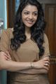 Actress Kajal Photoshoot Pics in Light Brown T Shirt & Blue Jeans