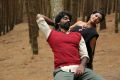 Arjuna, Varsha Ashwathi in Kangaroo Tamil Movie Stills