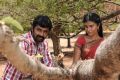 Udhaya Kumar, Rhythamika in Karisalpattiyum Gandhinagarum Movie Stills