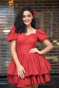 Actress Kashish Khan Photos in Red Short Skirt