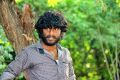 Hero Tamizh in Kida Poosari Magudi Movie Photos