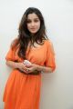 Madhurima Photos in Orange Dress at Healthy Curves Spa Launch