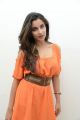 Actress Madhurima Hot Photoshoot Stills in Orange Dress