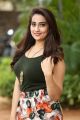 Telugu TV Anchor Manjusha Photos in Black T-Shirt & Floral Wide-Leg 3/4th Pants