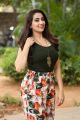 Telugu TV Anchor Manjusha Photos in Black T-Shirt & Floral Wide-Leg 3/4th Pants