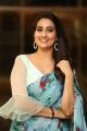 TV Anchor Manjusha Pics in White Sleeveless Blouse with Light Blue Floral Saree