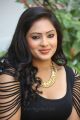 Actress Nikesha Patel Hot Stills in Tight Black Skirt