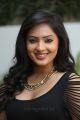 Actress Nikesha Patel Hot in Black Tight Skirt Stills