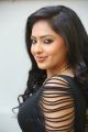 Actress Nikesha Patel Hot Stills in Black Tight Skirt