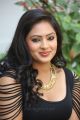 Actress Nikesha Patel Hot Stills in Black Tight Skirt