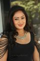 Actress Nikesha Patel Hot Stills in Tight Black Skirt