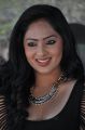 Actress Nikesha Patel Hot Stills in Black Tight Skirt