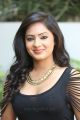 Actress Nikesha Patel Hot Stills in Black Tight Skirt