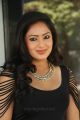 Actress Nikesha Patel Hot Stills in Black Tight Skirt