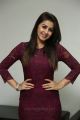 Actress Nikki Galrani Photos in Purple Dress @ Marakathamani Movie Interview