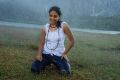 Actress Nithya Menon Wet Photos in Rain Song