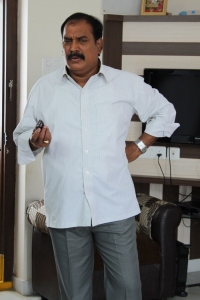 Ahuti Prasad in NRI Telugu Movie Stills