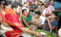 Ramcharan and Upasana serve food to pilgrims at Tirumala