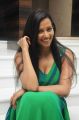Actress Sanjana Singh Spicy Hot Stills in Green Long Dress