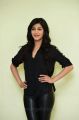 Actress Shruti Hassan in Black Relaxed Shirt & Tight Leather Pants