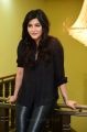 Actress Shruti Hassan in Black Shirt & Leather Jeans Photos