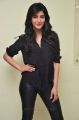 Actress Shruti Haasan in Black Relaxed Shirt & Tight Leather Pants