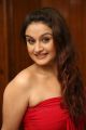 Sonia Agarwal in Red Mini Dress Hot Photo Shoot Stills